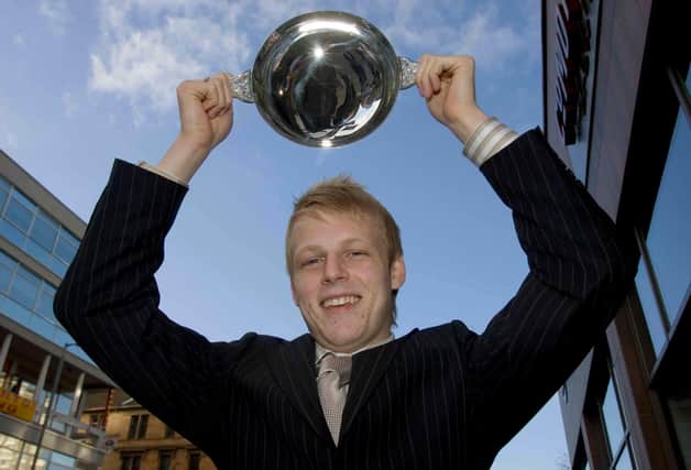 Kilmarnock striker Steven Naismith holds aloft the Scottish Football Writers Association Young Player of the Year Award for 2005/2006.