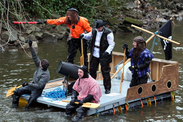 Captain Jack Sparrow and the crew of the Black Pearl point the way forward down the murky depths of the River Derwent during the annual Boxing Day Raft Race in Matlock in 2007