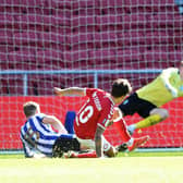 Bristol City's Jamie Paterson beats Sheffield Wednesday's Cameron Dawson to put the seal on a 2-0 win for the home side in the Sky Bet Championship at Ashton Gate this afternoon. Photo: Steve Ellis.