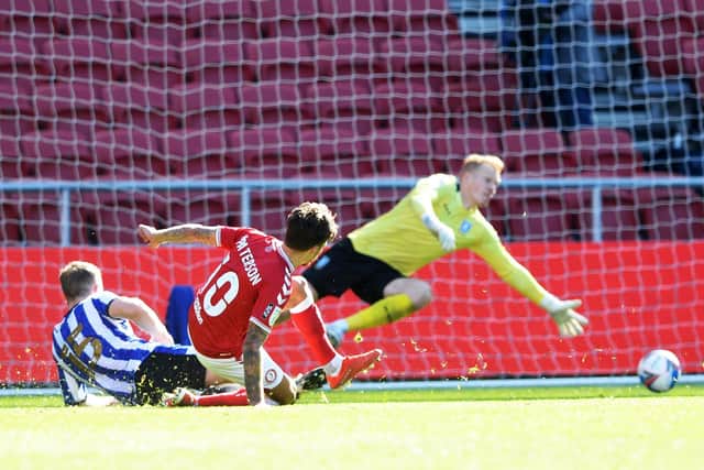Bristol City's Jamie Paterson beats Sheffield Wednesday's Cameron Dawson to put the seal on a 2-0 win for the home side in the Sky Bet Championship at Ashton Gate this afternoon. Photo: Steve Ellis.