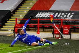 Leicester City's Jamie Vardy celebrates scoring his team's second goal by sliding into the corner flag during the  Premier League  match between Sheffield United and Leicester City at Bramall Lane  (Photo by JASON CAIRNDUFF/POOL/AFP via Getty Images)