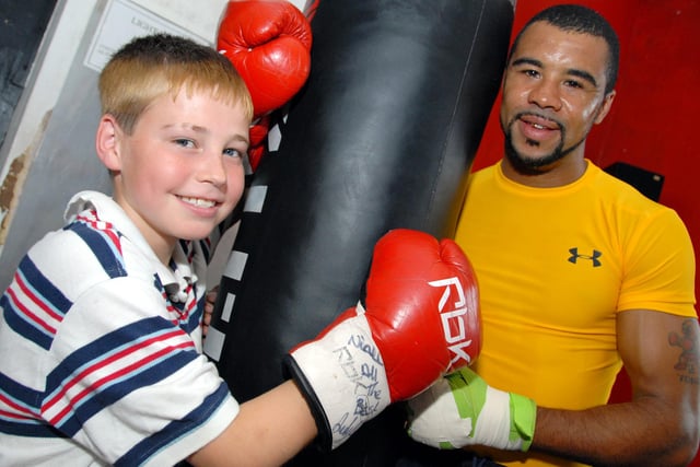 English super bantamweight Rendall Munroe visited Mansfield's Body and Soul Gym on Saturday for his first sparring sessions in preperation for his World title fight in Tokyo in 2010. Rendall, right, is pictured with local youngsters, Niall McGhee from Mansfield Woodhouse, whose brother Kieran stepped into the ring with Rendall during the session.