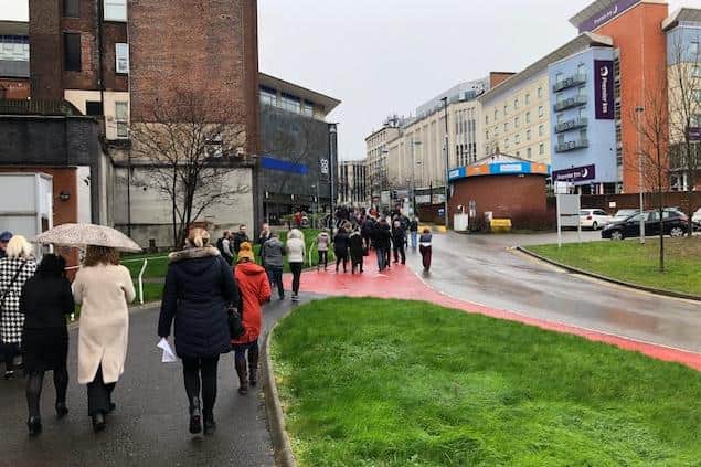 Pictured are staff and visitors exiting Sheffield Magistrates' Court after the building had to be evacuated after a suspected "emergency".