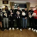 The new dads of Chapeltown Royal British Legion FC, oldest to youngest - Assistant manager Dave Adams with Jaxon, Dave Millen with Mason, Josh Savage with Elias, Ash Gray with Otis, Adam Simpson with Jack, Matt Bruck with Ada, Mitch Savage with Lennie, and manager Adam Todd with Edie.