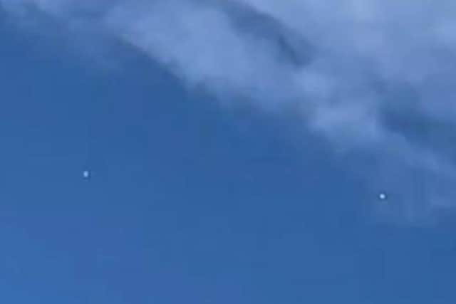 Neil Levesley spotted two mysterious objects in the sky above his home on the triangle estate, in Handsworth, on a Wednesday morning. The picture shows one on the left and on the right