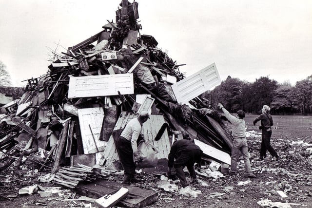 Men from the Sheffield Recreation Department build up a giant bonfire in preparation for Guy Fawkes night celebrations in Endcliffe Park - November 2, 1981