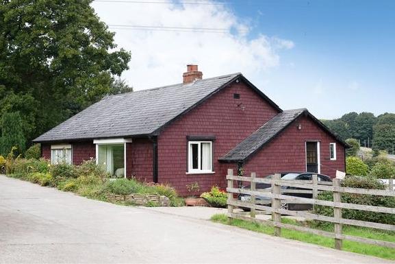 The extensive outbuildings at Ashday Hall include a detached farm cottage.