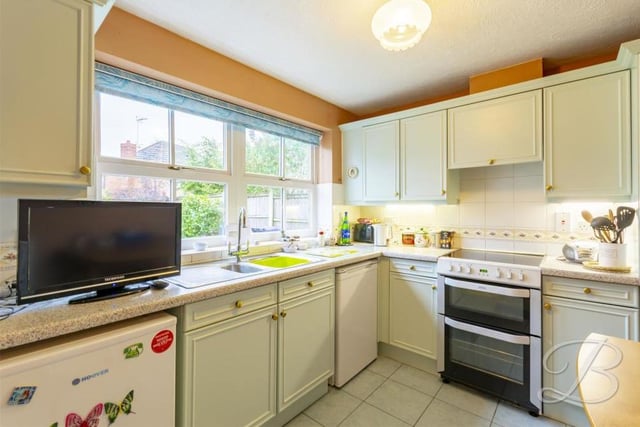 The home's bright kitchen comes complete with a range of matching units and cabinets, with work surfaces over and an inset sink and drainer. There is also space and plumbing for a dishwasher.