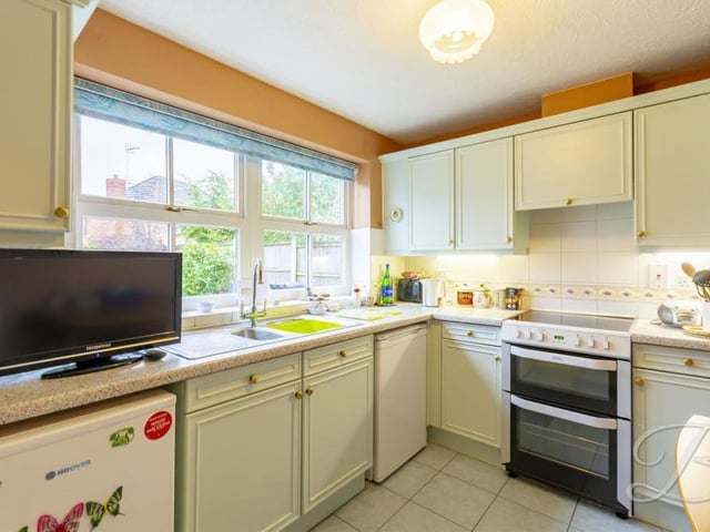 The home's bright kitchen comes complete with a range of matching units and cabinets, with work surfaces over and an inset sink and drainer. There is also space and plumbing for a dishwasher.