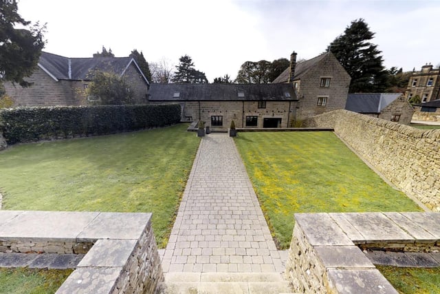In a private gated plot set back from the road there is a large gated drive and to the rear, "beautifully manicured and low maintenance gardens".