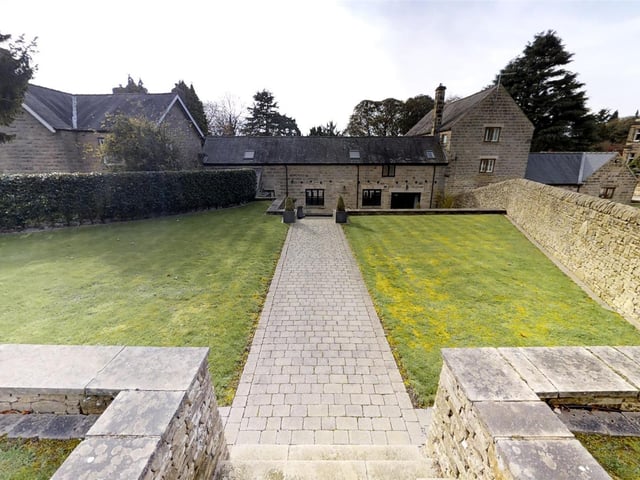 In a private gated plot set back from the road there is a large gated drive and to the rear, "beautifully manicured and low maintenance gardens".