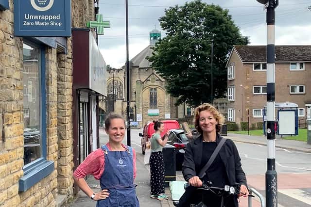 Dr Jo Maher (right) doing her shopping by e-bike at Crookes.