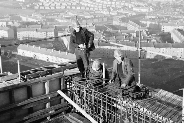 Housing at Castlemilk - Glasgow - Men at work on 20 storey multi flats.
