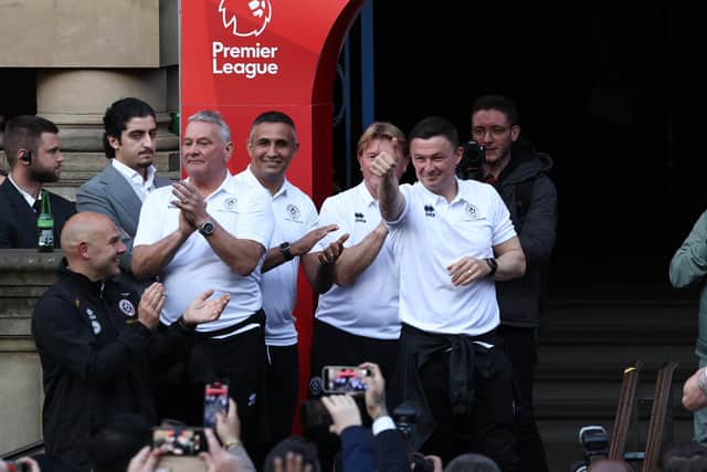 Sheffield United's coaching staff celebrate promotion to the Premier League: Darren Staples/Sportimage