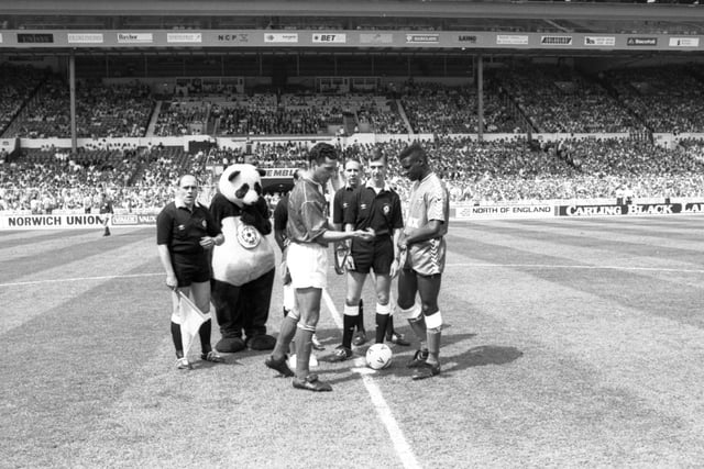 The pre-match coin toss at Wembley Stadium... featuring a big panda!