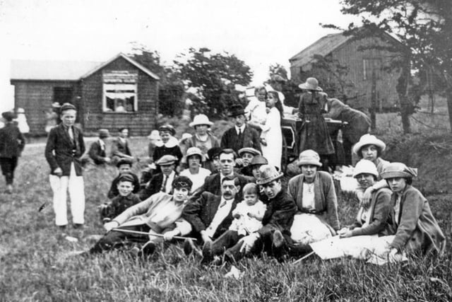 The Rackham Family of Elmham Road, Darnall, at the end of the Whitsuntide Parade in Sheffield's High Hazels Park in 1932, with the ice-cream cabin in the background