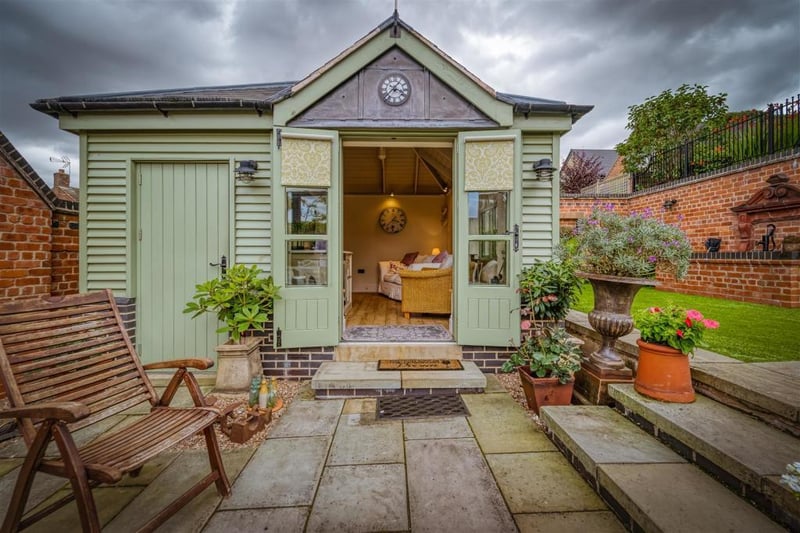 The large summerhouse is a focal point of the rear garden.