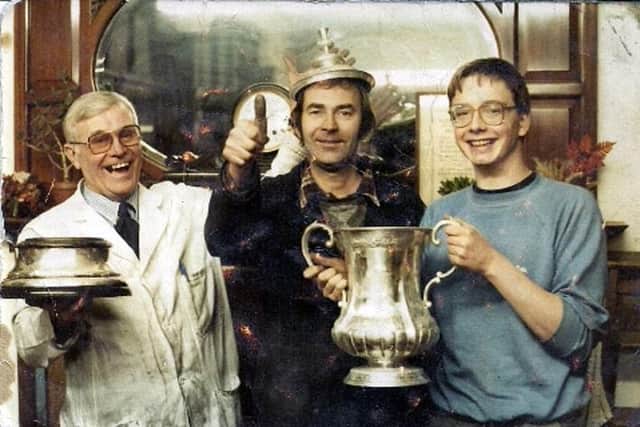 Bernard Halliwell with the base of the FA Cup, Bill Justice with the cover and apprentice chaser Steve Loxley holding the cup itself