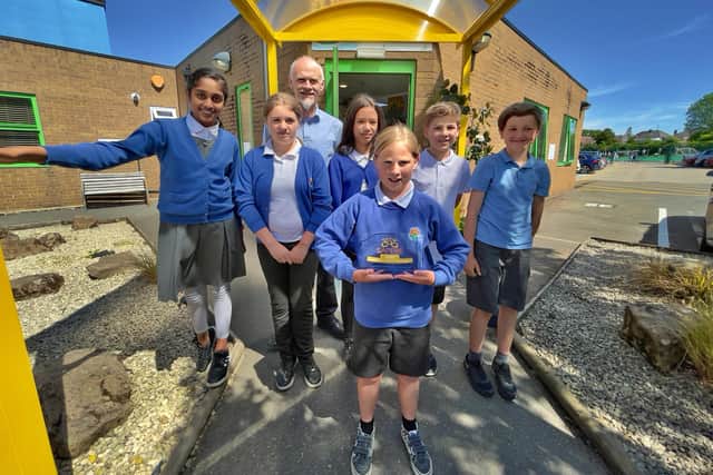 Headteacher Paul Stockley (behind) with the pupils from left Tishalee Devegee Ramsamy, Kasha Pinder, Alice Bishop, Reuben Williams, Teddie Heard and Jemima Jackson (front) all aged 11. Picture by Saiful Hisyam.