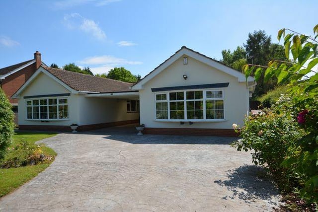 This five bedroom bungalow has an outdoor heated swimming pool.