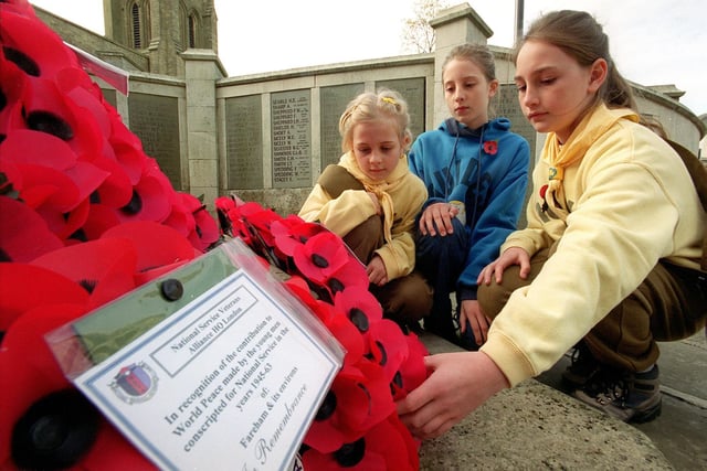 Fareham Remembers in 2011
(left to right) Stephenie Hoad (7) and her sisters Bianca (11), Katherine (9) lay a wreath at Fareham War Memorial in West Street to Remember those who died at war.  Remembrance service outside Trinity Church, West Street, Fareham. Picture Allan Hutchings (015859-4)