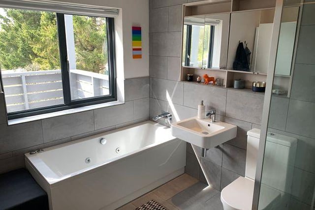 The bathroom has a fitted bath with Jacuzzi outlets, fully tiled floor and walls and a walk-in-shower with glass screen.