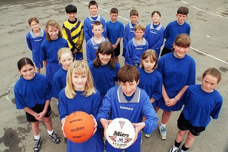 Intake Primary School U-11 netball, football and athletics teams. In the foreground are team captains, Lois Wragg and Ben Starosta, April 1998