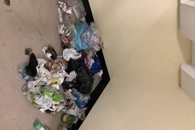 The young man reportedly goes out every night, drags bin bags into the flat's lobby and opens them. Residents clean it up the next day.
