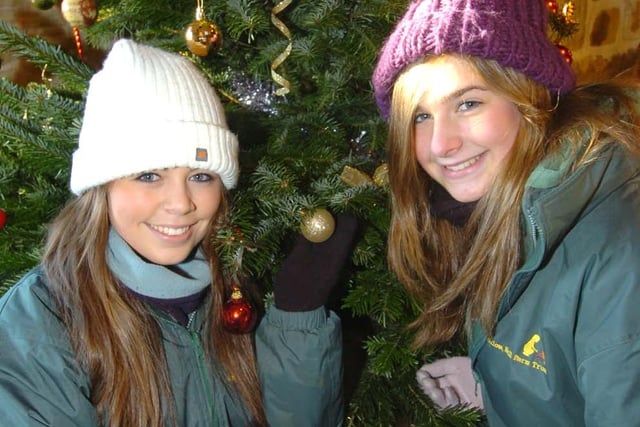 Anna Graham, left, and Ashleigh Hogan with a Christmas tree at Whirlow Hall Farm, Sheffield in November 2010