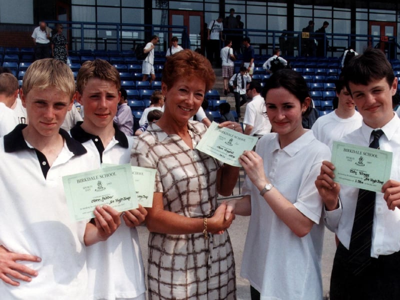 Birkdale pupils receive certificates from former Olympic champion Ann Brightwell, nee Packer, at the school's sports day (July 1997)