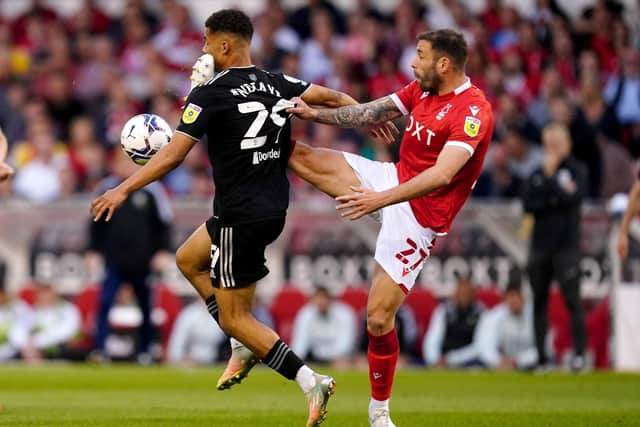 Nottingham Forest's Steve Cook battles for the ball with Sheffield United's Iliman Ndiaye during the Sky Bet Championship play-off semi-final, second leg match at the City Ground, Nottingham. PA Photo.