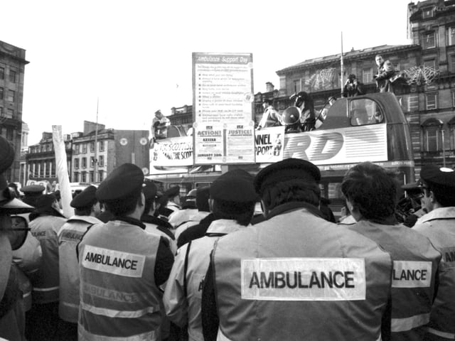 A demonstration and rally to support the ambulance workers' strike gathers in George Square Glasgow, January 1990.