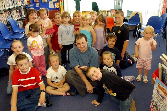 A Zoolab visit with lots of exotic creatures got the attention of all these children at Throston Grange Library in 2004.