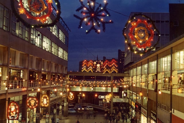 Christmas lights on Exchange Street showing shops on The Gallery, Castle Market, 1982. Picture Sheffield