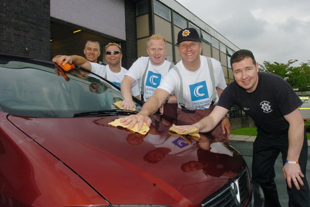 Firefighters at Mansfield Road Fire Station wash cars to raise money for the Cavendish centre in 2006