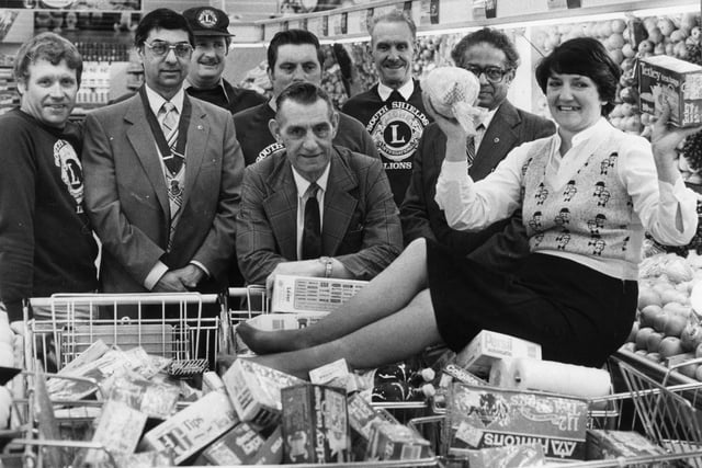 Margaret Raine did a three minute trolley dash round Hinton's store for her father George Elsy, centre, when  his ticket came up in a draw held by the Lions Club. Remember this?