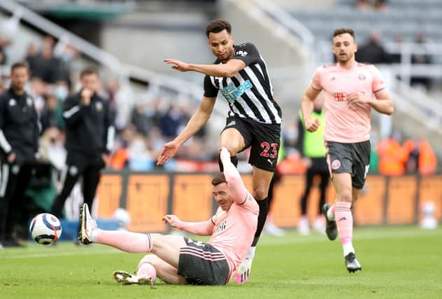 Newcastle United's Jacob Murphy (right) and Sheffield United's John Fleck battle for the ball: Carl Recine/PA Wire.