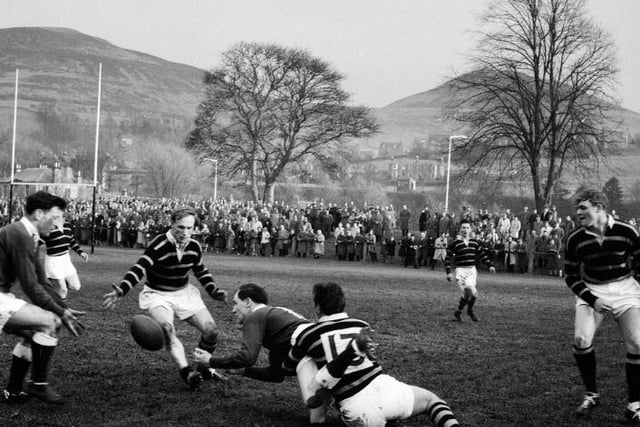 Rugby at the Greenyards - Melrose v Hawick, April 1963. G.D. Stevenson gets his pass away.