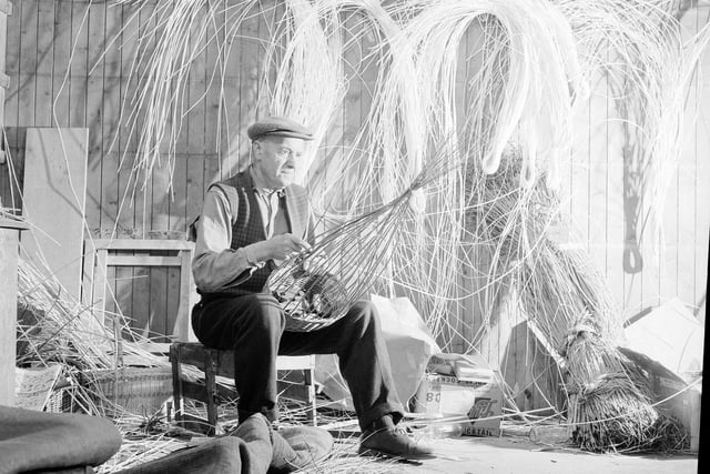 Basket maker William Taylor at work in one of the houses