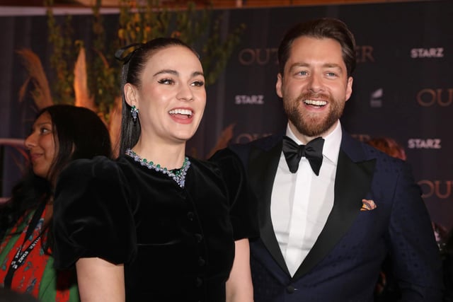 Sophie Skelton and Richard Rankin (Brianna and Roger) attend the Outlander Season Six premiere in London.