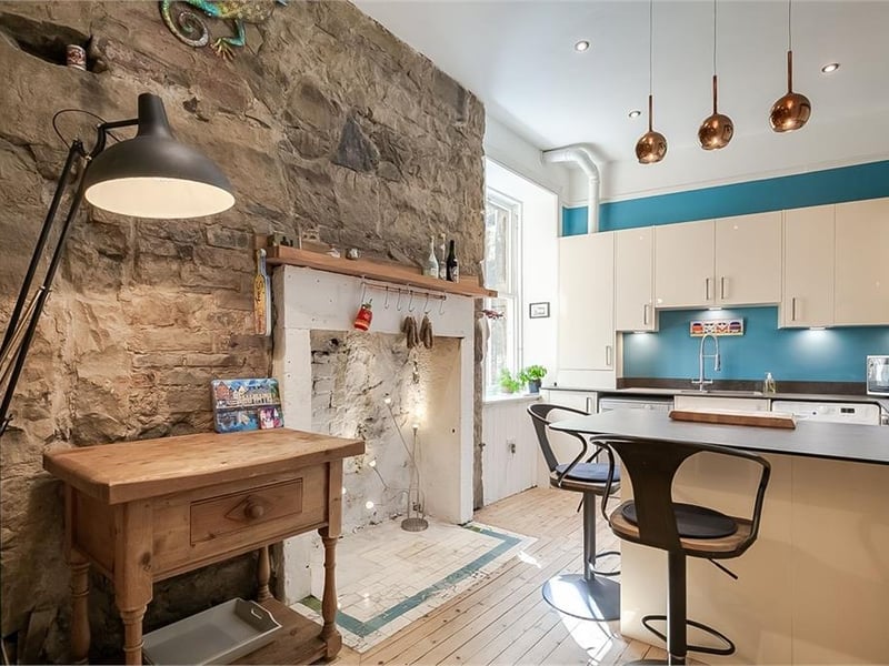 Feature stone wall in kitchen.