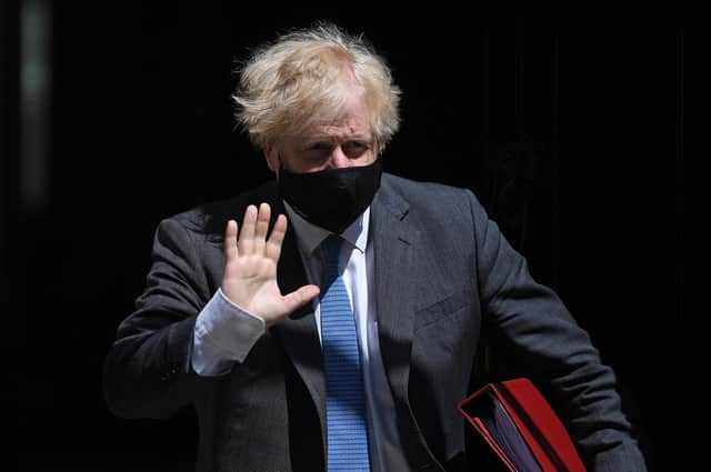 Prime Minister Boris Johnson wearing a face mask to combat the spread of Covid-19