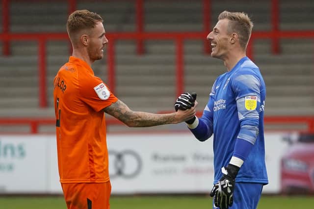 Portsmouth win in extra time, penalties. Craig MacGillivray of Portsmouth and Tom Naylor of Portsmouth during the EFL Cup match between Stevenage and Portsmouth at the Lamex Stadium, Stevenage, England on 29 August 2020.