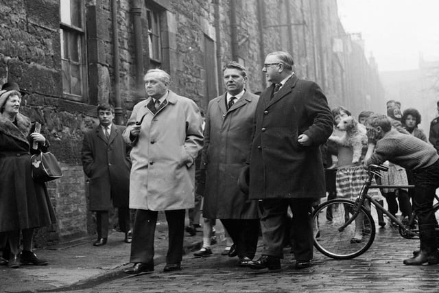 Harold Wilson is accompanied by two Labour councillors Mr Pat Rogan and Mr Magnus Williamson walking along Jamaica Street Edinburgh in March 1964.