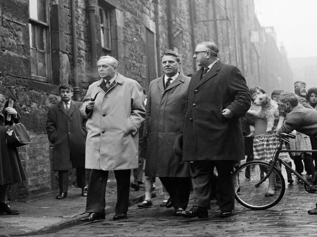 Harold Wilson is accompanied by two Labour councillors Mr Pat Rogan and Mr Magnus Williamson walking along Jamaica Street Edinburgh in March 1964.