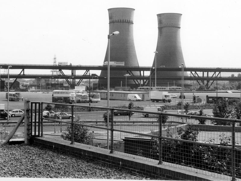 Looking across Meadowhall Coach Park towards cooling towers, Blackburn Meadows Power Station and Tinsley Viaduct.