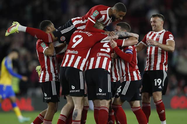 Sheffield, England, 21st September 2021. Enda Stevens of Sheffield United celebrates with team mates after scoring the first goal during the Carabao Cup match at Bramall Lane: Darren Staples / Sportimage