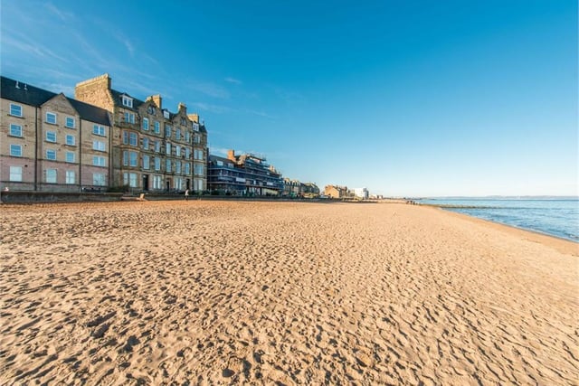 The flat is located right on Portobello beach, a prime spot for sunny days.