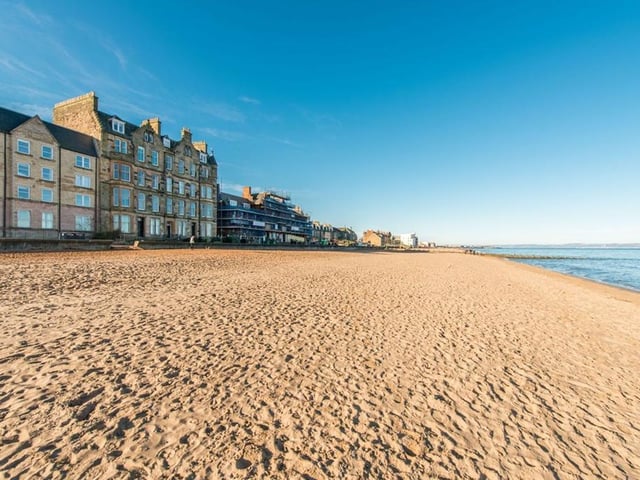The flat is located right on Portobello beach, a prime spot for sunny days.