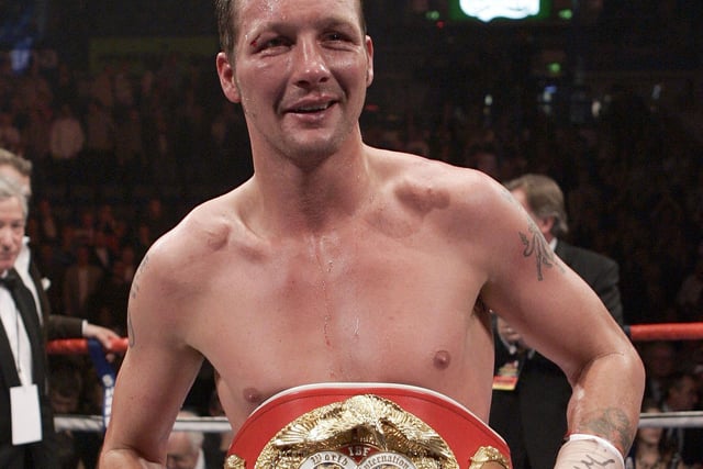 Clinton Woods celebrates winning his IBF World title fight against Julio Gonzalez at Sheffield Arena on September 29, 2007
